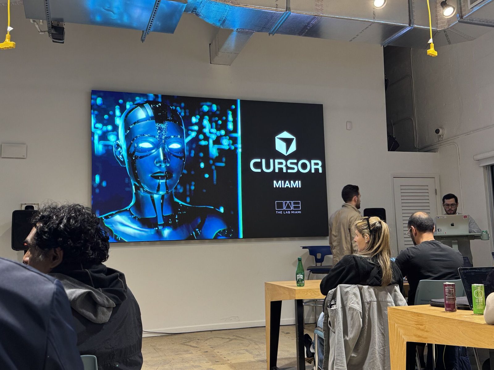 Cursor Miami branding on the LED wall at the February meetup
